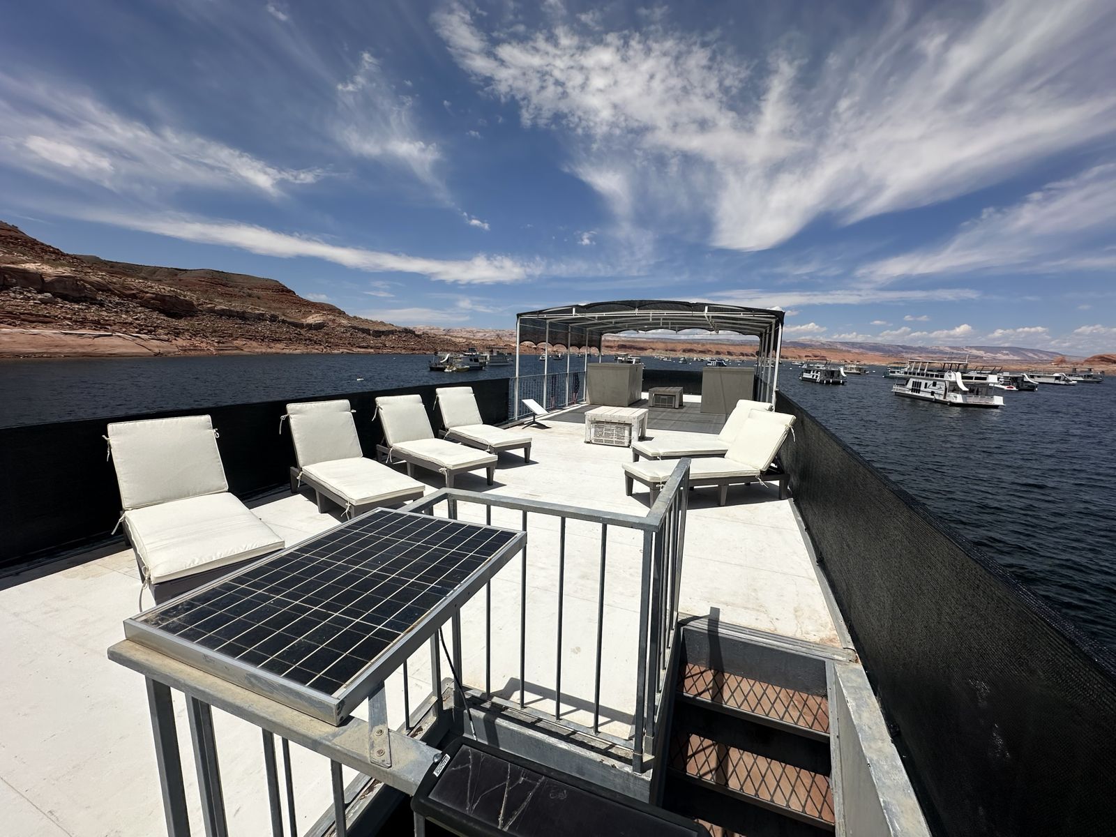 Red Rock Paradise top deck with sun loungers and shade canopy over Lake Powell